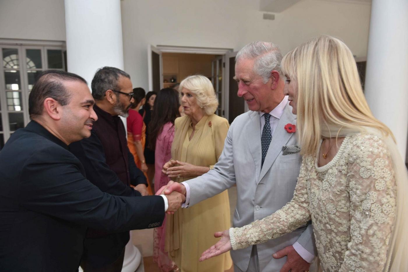 Billionaire diamond trader Nirav Modi (R) shakes hands with TRH Charles, Prince of Wales and Camilla, Duchess of Cornwall. (File Photo: IANS) by . 
