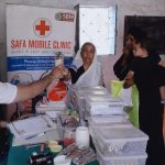 Medicines being given to the needy. by .
