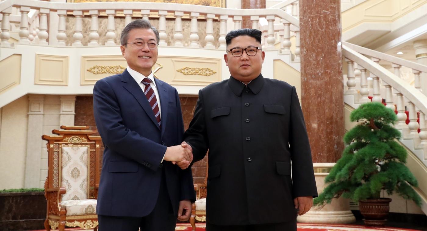 Pyongyang: South Korean President Moon Jae-in (L) and North Korean leader Kim Jong-un shake hands before their summit talks at the headquarters of the North's Workers' Party Central Committee in Pyongyang on Sept. 18, 2018. It was the first time that the headquarters, which houses offices of the North's top ranking officials, including Kim, was opened to a foreign leader. (Yonhap/IANS) by . 