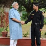 Laksham Singh Bisht with Narendra Modi while serving as NSG Commando. by . 