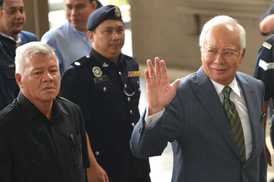 KUALA LUMPUR, Aug. 8, 2018 (Xinhua) -- Former Malaysian Prime Minister Najib Razak (R) appears at the Kuala Lumpur Courts complex in Kuala Lumpur in Malaysia, Aug. 8, 2018. Former Malaysian Prime Minister Najib Razak on Wednesday was charged with three offenses related to money-laundering and anti-terrorism financing, in addition to several counts of criminal breach of trust and corruption charges that were served in early July. (Xinhua/Chong Voon Chung/IANS) by . 