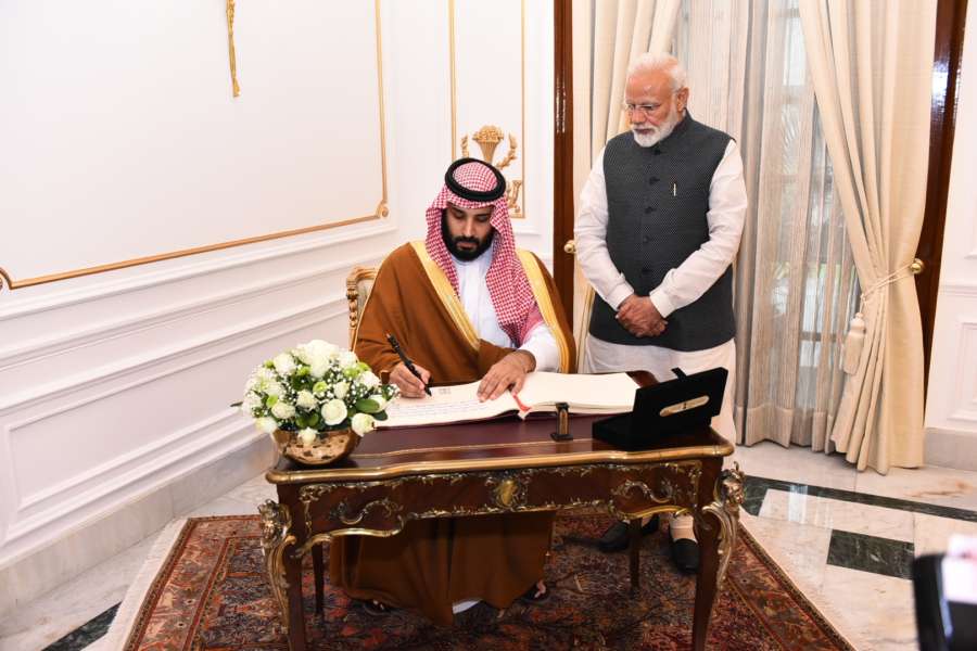 New Delhi: Saudi Crown Prince Mohammed bin Salman signs the Visitor's Book as Prime Minister Narendra Modi looks on, at Hyderabad House, in New Delhi, on Feb 20, 2019. (Photo: IANS/MEA) by . 