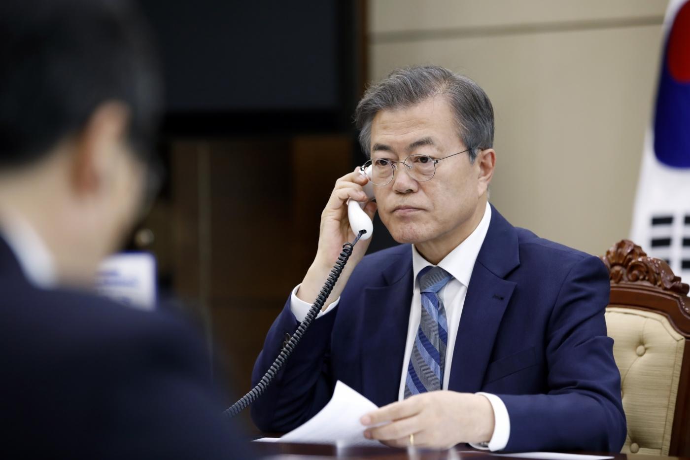 Seoul: South Korean President Moon Jae-in has a telephone conversation with Japanese Prime Minister Shinzo Abe at his office in Seoul on April 24, 2018, in this photo provided by the office. Abe expressed his hope to meet with North Korean leader Kim Jong-un to discuss ways to normalize the countries' ties, while asking Moon to help resolve the issue of Japanese citizens abducted by the communist state.(Yonhap/IANS) by .