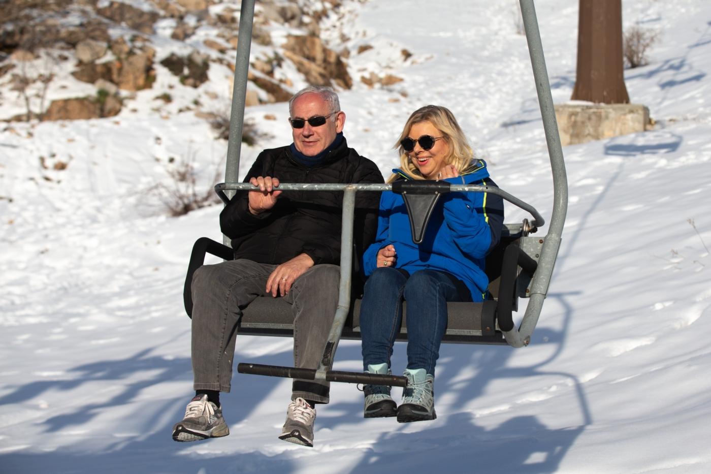 GOLAN HEIGHTS, April 23, 2019 (Xinhua) -- Israeli Prime Minister Benjamin Netanyahu (L) and his wife Sarah Netanyahu are seen on a chairlift at the Hermon resort on the Golan Heights, on April 23, 2019. Israeli Prime Minister Benjamin Netanyahu said on Tuesday that he will name a new community in the Golan Heights after U.S. President Donald Trump, who recognized Israel's sovereignty over the occupied Syrian territory in March. (Xinhua/JINI/IANS) by .