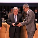 United Nations Secretary-General Antonio Guterres presents to India's Permanent Representative Syed Akbaruddin, right, the Dag Hammarksjold Medal honouring Indian peacekeeper Jitender Kumar, a police officer who laid down his life while serving the UN Organization Stabilization Mission in the Democratic Republic of the Congo (MONUSCO). At left is Jean-Pierre Lacroix, the Under-Secretary-General for Peace Operations. (Photo: Indian Mission/IANS) by . 
