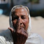 Amritsar: An elderly lady shows her forefinger marked with indelible ink after casting vote during the seventh and the last phase of 2019 Lok Sabha Elections at a polling booth in Amritsar on May 19, 2019. (Photo: IANS) by .
