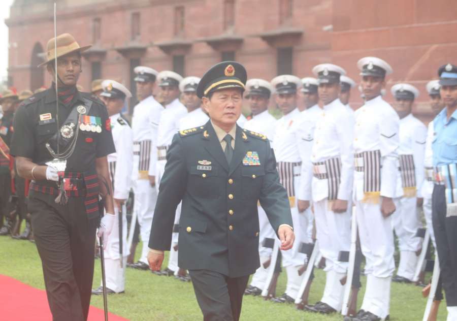 New Delhi: China's Defence Minister Gen. Wei Fenghe observes the Tri-Services Guard of Honour on his arrival at the South Block, in New Delhi on Aug 23, 2018. (Photo: IANS) by . 