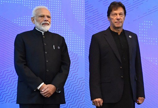 Prime Minister Narendra Modi and Pakistan Prime Minister Imran Khan at the SCO (Shanghai Cooperation Organisation) Council of Heads of State Meeting in Bishkek, Kyrgyzstan on June 14, 2019. (File Photo: IANS) by . 