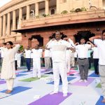 New Delhi: Lok Sabha Speaker Om Birla and BJP MP Bhupender Yadav practice yoga asanas -postures- on International Yoga Day 2019 at Parliament premises in New Delhi on June 21, 2019. (Photo: IANS) by . 
