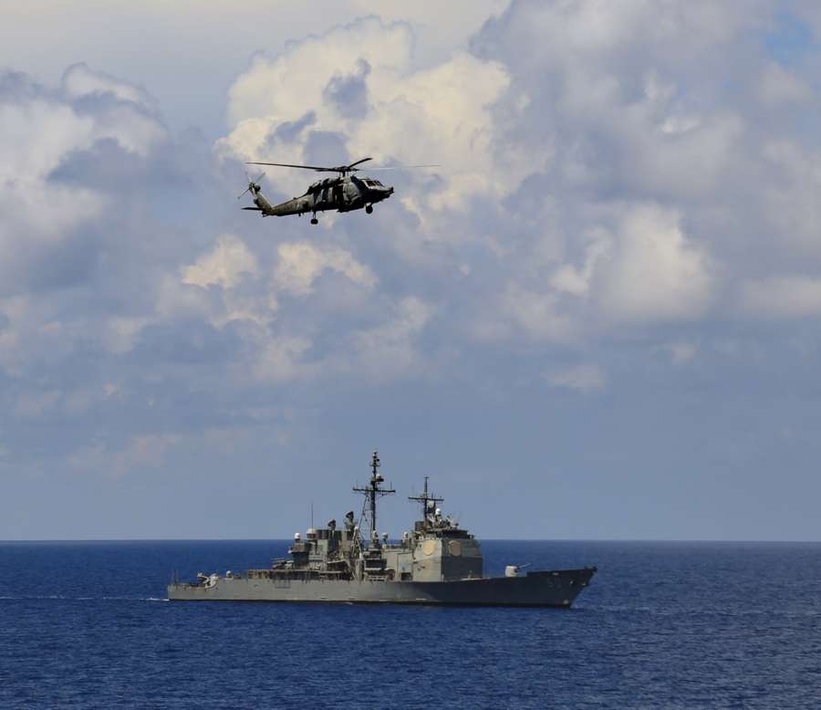 Indian Ocean: Sikorsky Multi-role helicopter and USS Normandy, a Ticonderoga class destroyer during the ongoing Exercise Malabar-2015 in the Indian Ocean on Oct 18, 2015. (Photo: IANS) by . 
