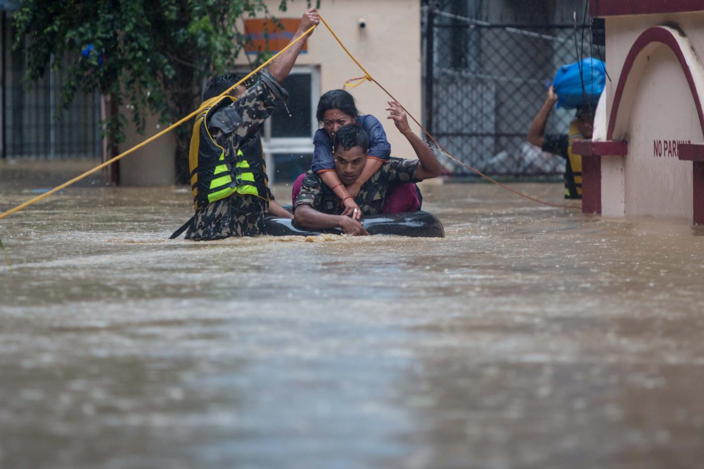 KATHMANDU, July 12, 2019 (Xinhua) -- Nepalese army personnel rescue local people after a heavy rainfall in Kathmandu, Nepal, July 12, 2019. Nepal was hit by heavy rainfall that caused floods and landslides in many places. (Xinhua/Sulav Shrestha/IANS) by sulav shrestha. 
