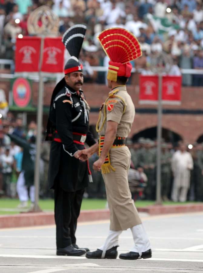 Attari: Beating Retreat ceremony underway at Attari-Wagha border on the eve of Independence Day in Attari near Amritsar on Aug 14, 2019. (Photo: IANS) by . 