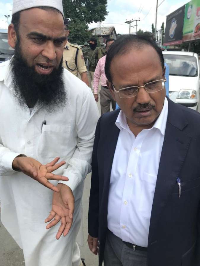Anantnag: National Security Advisor (NSA) Ajit Doval interacts with public in Anantnag, Jammu and Kashmir on Aug, 10 2019. (Photo: IANS) by . 