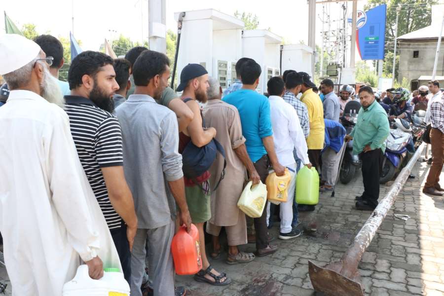 Srinagar: A rush of people at a petrol pump in Srinagar on Aug 3, 2019. The state government in an advisory on Friday said, "Keeping in view the latest intelligence inputs of terror threats, with specific targeting of the Amarnath Yatra, and given the prevailing security situation in the Kashmir Valley, in the interest of safety and security of the tourists and Amarnath Yatris, it is advised that they may curtail their stay in the Valley immediately and take necessary measures to return as soon as possible." (Photo: IANS) by . 