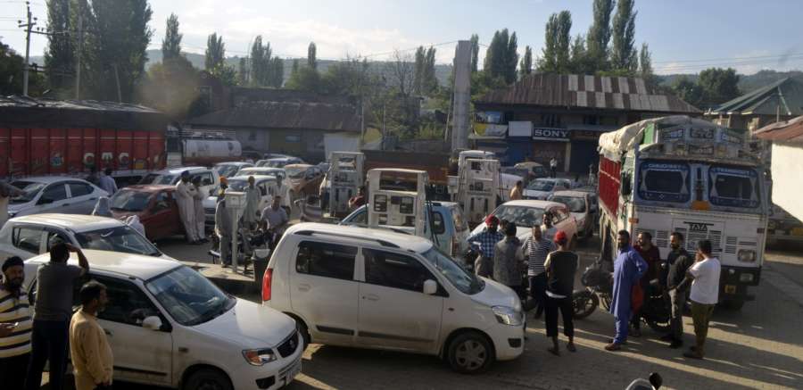Baramulla: People queue up outside a petrol pump in Baramulla, Jammu and Kashmir on Aug 3, 2019. Most people in Jammu and Kashmir, especially in the Valley, believe that Article 35A of the Constitution is going amid reports that the idea of dividing the state into three union territories of Jammu, Valley and Ladakh is also being toyed with. (Photo: IANS) by . 