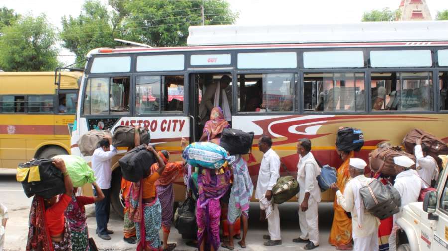 Jammu: Amarnath pilgrims board a bus from Bhagwati Nagar base camp as they leave for their respective homes after the Jammu and Kashmir Administration on Friday advised the tourists and yatris that "they may curtail their stay in the Valley immediately and take necessary measures to return as soon as possible", in Jammu on Aug 3, 2019. (Photo: IANS) by . 