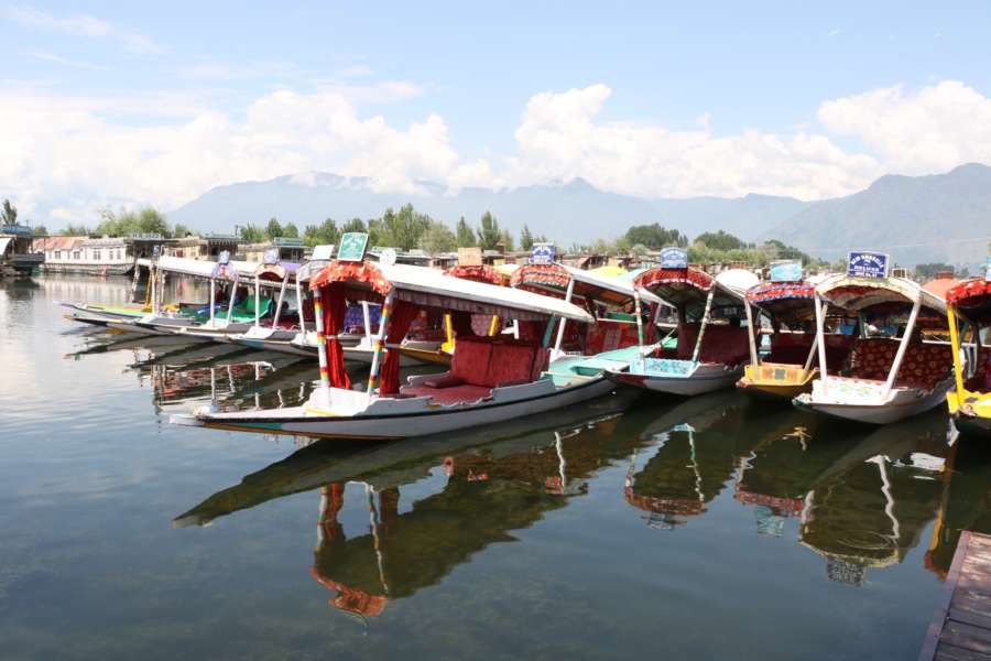 Srinagar: Shikaras anchored on the banks of Srinagar's Dal Lake as tourists leave Jammu and Kashmir after the Indian government advised Amarnath pilgrims and tourists to leave in view of the security situation. (Photo: IANS) by . 