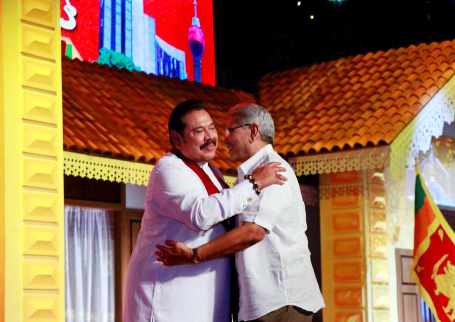 COLOMBO, Aug. 11, 2019 (Xinhua) -- Sri Lanka's opposition leader Mahinda Rajapaksa (L) hugs his brother, former defense secretary Gotabaya Rajapaksa, at a Sri Lanka Podujana Peramuna (SLPP) party conference held in Colombo, capital of Sri Lanka, Aug. 11, 2019. Sri Lanka's opposition leader Mahinda Rajapaksa on Sunday named his brother and former defense secretary Gotabaya Rajapaksa as the opposition's presidential candidate in a presidential race which will be held later this year. Sri Lankan President Maithripala Sirisena said recently that the Presidential Elections is likely to be held in November or December. (Photo by Ajith Perera/Xinhua/IANS) by Ajith Perera. 