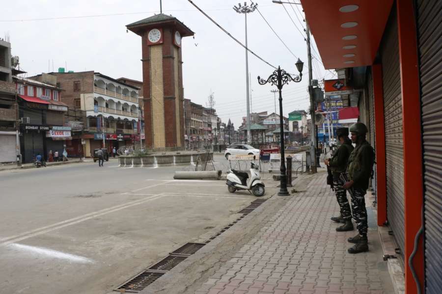 Srinagar: Security beefed up as authorities imposed restrictions in parts of Srinagar city to prevent separatist called protests in connection with the Martyrs Day, on July 13, 2019. July 13 is observed as Martyrs Day in Jammu and Kashmir to remember those killed in the firing outside the Srinagar Central Jail by forces of the Dogra Maharaja in 1931. Shops, public transport and other businesses remained closed in Srinagar and many other towns in the Kashmir Valley. (Photo: IANS) by .