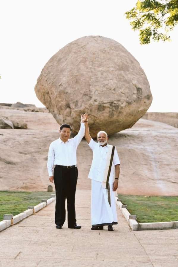 Mahabalipuram: Prime Minister Narendra Modi and Chinese President Xi Jinping during their visit to Krishna's butterball - a gigantic granite boulder sitting firmly on the slope of a hillock - in Mahabalipuram, Tamil Nadu on Oct 11, 2019. (Photo: IANS) by . 