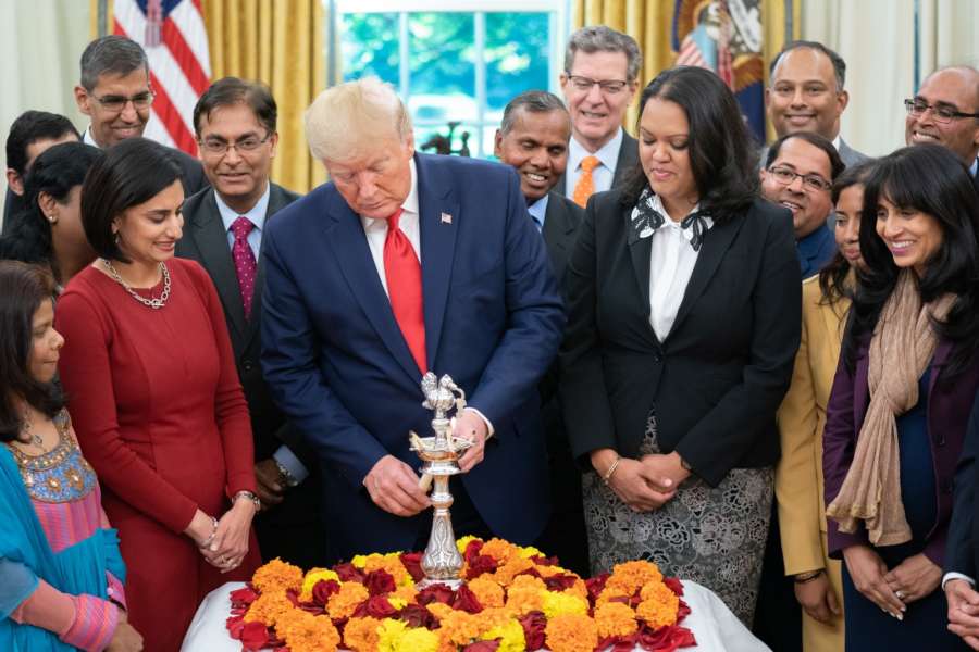 United States President Donald Trump lights lamp at the White House on Thursday, Oct. 24, 2016, at Diwali celebration. (Photo: White House/IANS) by .