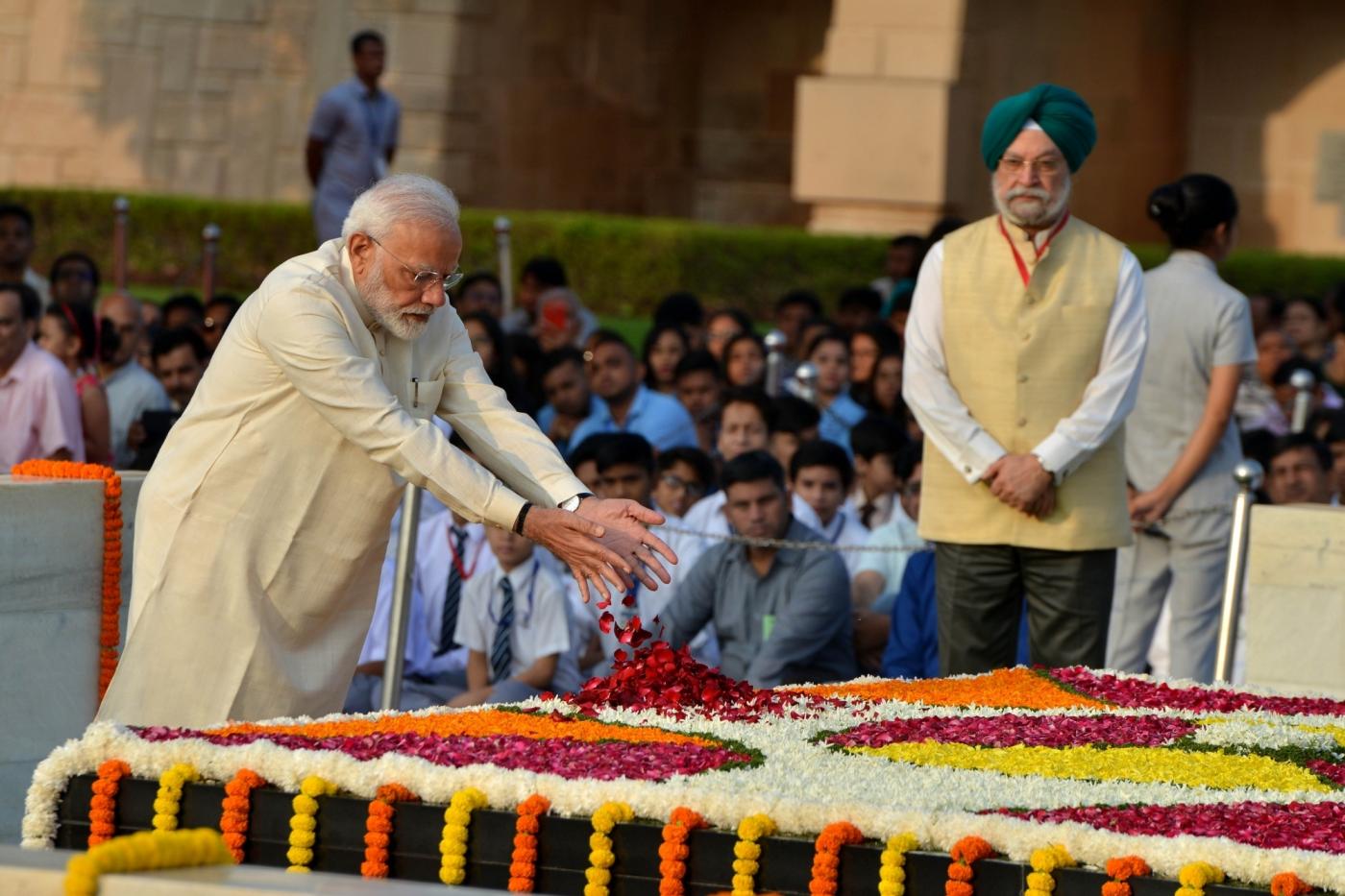 New Delhi: Prime minister Narendra Modi pays tribute to Mahatma Gandhi on his 150th birth Anniversary at Rajghat in New Delhi on Oct. 2, 2019. (Photo: IANS) by . 