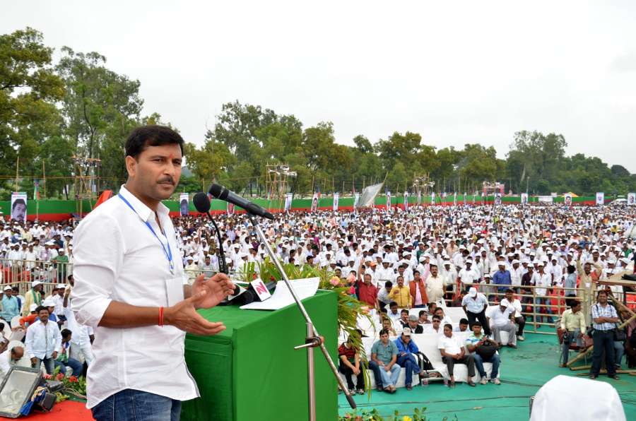All Jharkhand Students Union (AJSU) chief Sudesh Mahato addresses a rally at Prabhat Tara ground of Ranchi, on Sept. 21, 2014. (Photo: IANS) by .