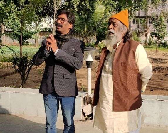 Ranchi: Jharkhand Mukti Morcha (JMM) leader Hemant Soren with his father and party chief Shibhu Soren during his visit to the latter's residence to seek his blessings, during the counting of votes for the Jharkhand Assembly elections, at Morabadi ground in Ranchi on Dec 23, 2019. Leaving the BJP behind, the Jharkhand Mukti Morcha (JMM) has emerged as the single largest party in the state assembly elections in the state, with 29 leads so far. The Congress, JMM and Rashtriya Janata Dal alliance is all set to form the government as per emerging trends of the Election Commission. (Photo: IANS) by .