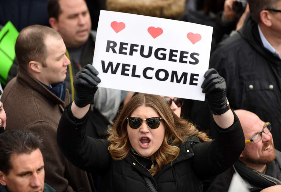 NEW YORK, Jan. 19, 2018 (Xinhua) -- File photo taken on Jan. 29, 2017 shows demonstrators participate in a protest against U.S. President Donald Trump's executive order temporarily barring all refugees and seven Mideast and North African countries' citizens from entry into the U.S. in front of the White House in Washington D.C., the Unite States. Protesters rallied in front of the White House on Sunday while demonstrations continued across more than 30 American airports after U.S. President Donald Trump signed an executive order temporarily barring all refugees and seven Mideast and North African countries' citizens from entry into the United States.Jan. 20, 2018 reaches one-year mark for Donald Trump as the 45th president of the United States. One year into U.S. President Donald Trump's presidency, the uncertainties and anxieties over his unconventional playbook appear to have not diminished. As he seeks to implement his campaign promises, which seem controversial and even unacceptable to many, rifts, feuds and controversies dogged the year and 2018 would probably not be any different. (Xinhua/Yin Bogu/IANS) by .