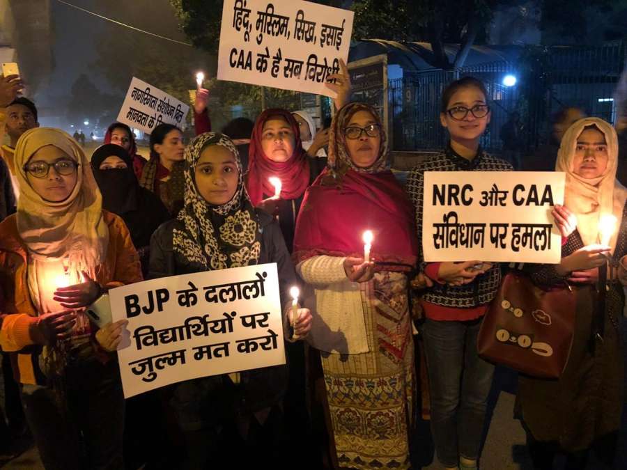 New Delhi: Muslim women participte in a candle light march to protest against Citizenship Amendment Act (CAA) 2019 and the NRC, in New Delhi on Dec 17, 2019. (Photo: IANS) by .