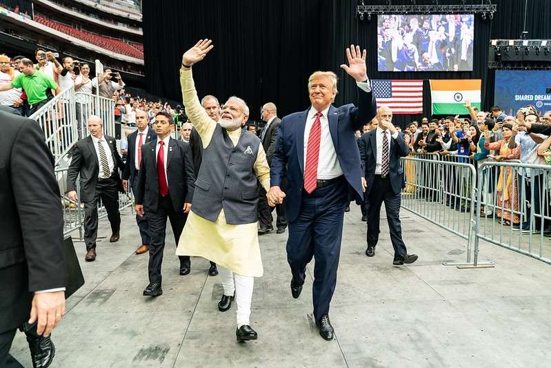 Prime Minister Narendra Modi and President Donald Trump stride around the Houston arena hand-in-hand on September 22, 2019, at the Howdy Modi event, a symbol of growing India-US ties. (Photo: White House/IANS). by .
