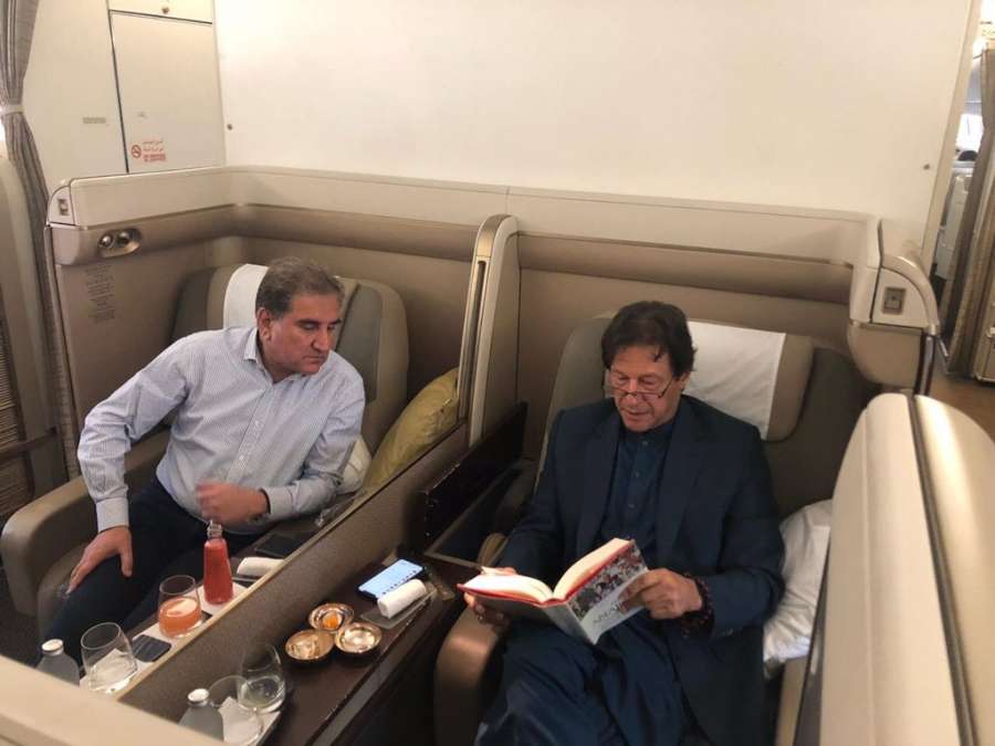 A photograph of Pakistan Prime Minister Imran Khan reading William Dalrymple's latest book 'The Anarchy' on his flight to Jeddah with Foreign Minister Shah Mahmood Qureshi peeking over from his seat has gone viral on social media. by . 