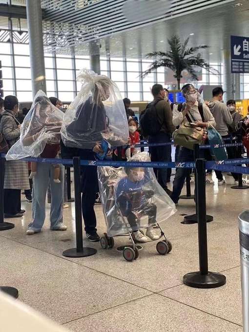 As the Novel coronavirus spreads rapidly in China and across the world, lots of photos of terrified travellers have been shared on social media, with people seen covering themselves with plastic sheets and even bottles in public. Photos of people at different locations using everyday items like empty water jars and plastic sheets to cover themselves are doing the rounds of the Internet. by . 