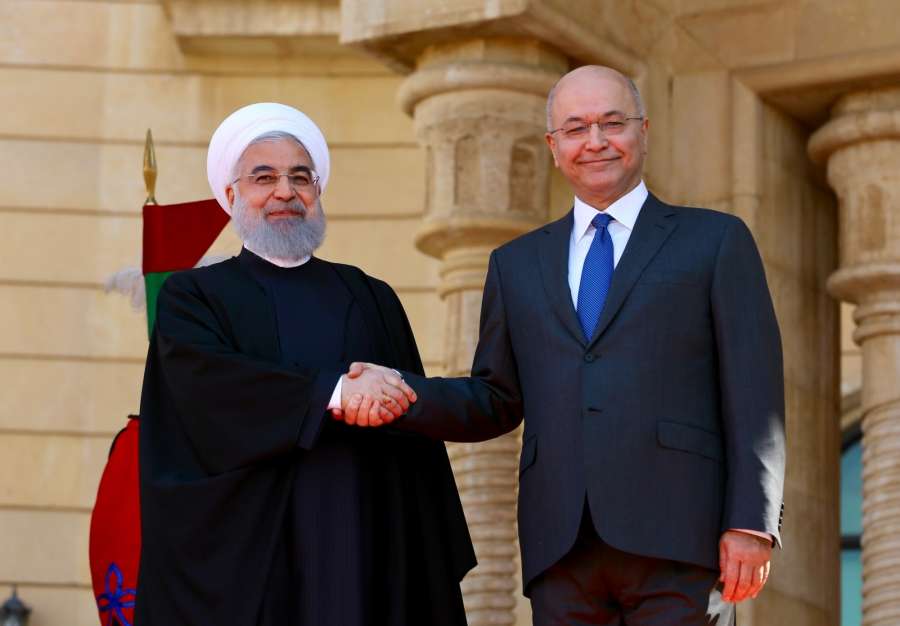 BAGHDAD, March 11, 2019 (Xinhua) -- Iraqi President Barham Salih (R) shakes hands with his Iranian counterpart Hassan Rouhani at the Presidential Palace in Baghdad, Iraq, March 11, 2019. Iranian President Hassan Rouhani arrived in Iraq's capital Baghdad Monday on an official visit aimed at boosting bilateral ties, the Iraqi official television reported. (Xinhua/Khalil Dawood/IANS) by .