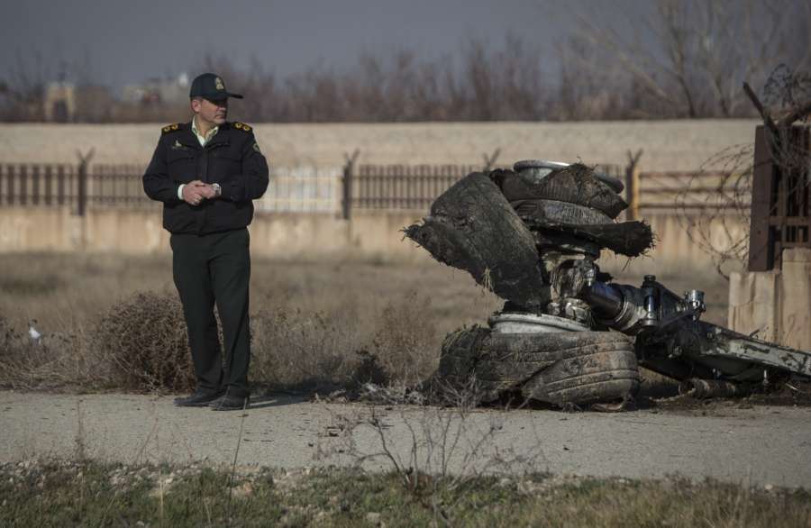 TEHRAN, Jan. 8, 2020 (Xinhua) -- A rescuer stands at the air crash site of a Boeing 737 Ukrainian passenger plane in Parand district, southern Tehran, Iran, on Jan. 8, 2020. All the passengers and crew members on board the Boeing 737 Ukrainian passenger plane that crashed near Tehran Imam Khomeini International Airport (IKA) on Wednesday morning are confirmed dead, official Islamic Republic News Agency (IRNA) reported. (Photo by Ahmad Halabisaz/Xinhua/IANS) by . 