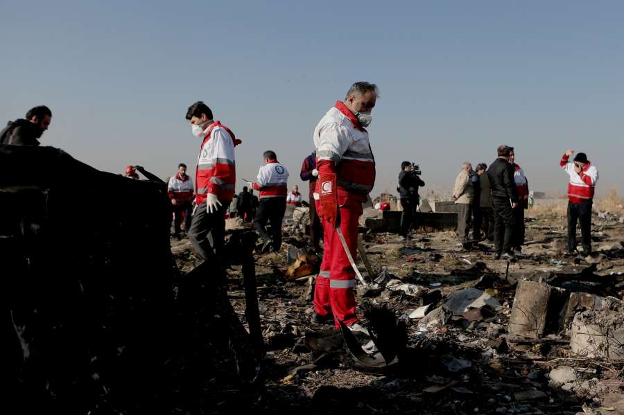 TEHRAN, Jan. 8, 2020 (Xinhua) -- Rescuers work at the air crash site of a Boeing 737 Ukrainian passenger plane in Parand district, southern Tehran, Iran, on Jan. 8, 2020. All the 179 passengers and crew members on board the Boeing 737 Ukrainian passenger plane that crashed near Tehran Imam Khomeini International Airport (IKA) on Wednesday morning were confirmed dead, Iran's Press TV reported. (Photo by Ahmad Halabisaz/Xinhua/IANS) by . 