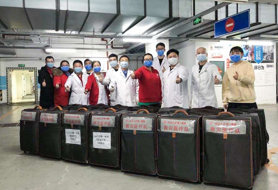 BEIJING, Jan. 26, 2020 (Xinhua) -- Workers pose with medical supplies they have prepared for a medical team in Beijing, capital of China, in this photo taken with a mobile phone on Jan. 25, 2020. A 121-member medical team, organized by the National Health Commission, left Beijing for Wuhan Sunday afternoon to aid the coronavirus control efforts there. (Photo by Fu Jingbo/Xinhua/IANS) by .