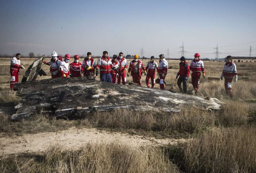 TEHRAN, Jan. 8, 2020 (Xinhua) -- Rescuers work at the air crash site of a Boeing 737 Ukrainian passenger plane in Parand district, southern Tehran, Iran, on Jan. 8, 2020. All the passengers and crew members on board the Boeing 737 Ukrainian passenger plane that crashed near Tehran Imam Khomeini International Airport (IKA) on Wednesday morning are confirmed dead, official Islamic Republic News Agency (IRNA) reported. (Photo by Ahmad Halabisaz/Xinhua/IANS) by . 