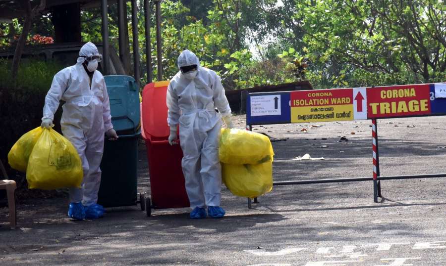Kochi: Medical staff wearing protective gear, take medical waste to dump it as they exit the Special Isolation Ward set up to provide treatment to novel coronavirus patients at Kochi Medical college, in Kerala on Feb 8, 2020. (Photo: IANS) by . 