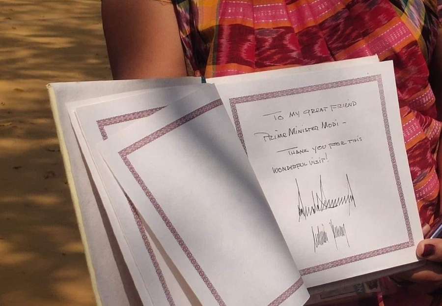 Trump signs visitor's book at Sabarmati Ashram, thanks 'friend' Modi for 'wonderful visit' by . 