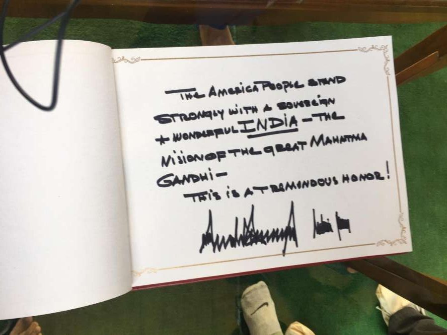 New Delhi: US President Donald Trump signs the Visitors Book during their visit to the Raj Ghat in New Delhi on Feb 25, 2020. (Photo: IANS) by . 