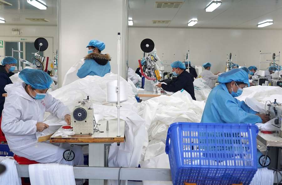 NANCHANG, Feb. 2, 2020 (Xinhua) -- Workers make protective suits at the workshop of a company in Jinxian County, east China's Jiangxi Province, Feb. 1, 2020. To help fight the outbreak of pneumonia caused by novel coronavirus, workers of many medical material companies rushed to work ahead of schedule to make protective equipment. (Xinhua/Wan Xiang/IANS) by . 