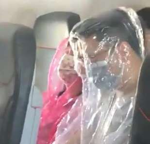 Scary!: Passengers cover themselves in plastic to avoid coronavirus. by . 