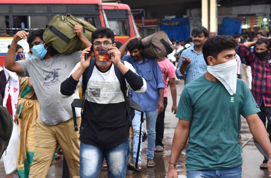Bengaluru: The Majestic Bus station crowded with migrant workers heading back home during complete lockdown in the country in a bid to curtail the spread of coronavirus, in Bengaluru on March 23, 2020. (Photo: IANS) by . 