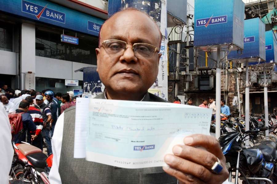 Patna: People queue up Yes Bank to withdraw cash in Patna on March 7, 2020. (Photo: IANS) by . 