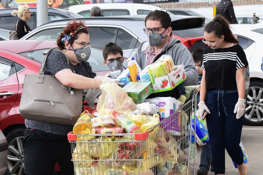 ROSH HAAYIN, March 15, 2020 (Xinhua) -- Local residents wearing face masks purchase daily necessities at a supermarket in the central Israeli city of Rosh Haayin, March 14, 2020. So far, 193 coronavirus cases have been reported in Israel, of whom four have recovered. (JINI/Handout via Xinhua/IANS) by . 