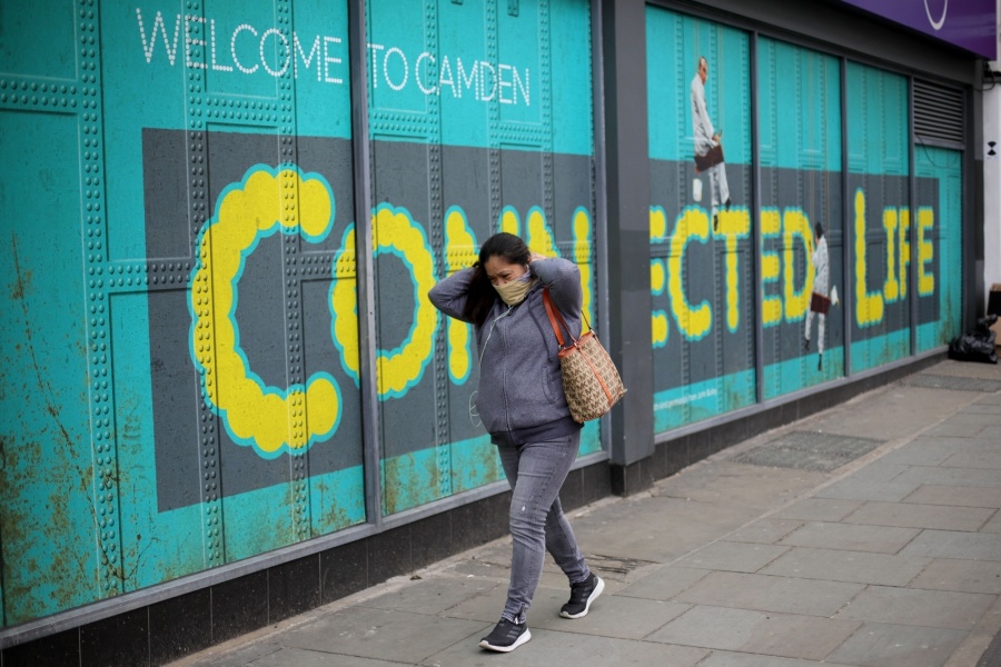 LONDON, April 18, 2020 (Xinhua) -- A woman walks past a closed shop on Camden High Street in London, Britain, April 17, 2020. Another 847 people who tested positive for COVID-19 have died in hospitals in Britain as of Thursday afternoon, bringing the total number of coronavirus-related deaths to 14,576, the Department of Health and Social Care said Friday. (Photo by Tim Ireland/Xinhua/IANS) by . 