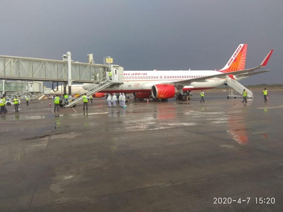 A special relief flight of Air India airlifted 99 US citizens stuck, in Hyderabad on Apr 7, 2020. The flight, which took off from Rajiv Gandhi International Airport (RGIA), carried the US citizens to Mumbai, from where they will be further connected with Delta Airlines from Mumbai to their final destination in the US. In coordination with the US Consulate and the Telangana State government, a group of 98 adults and one infant US-bound passengers arrived at the airport from various parts of Hyderabad. All these passengers were serviced through the fully-sanitized main passenger terminal building, which has been kept ready for evacuation operations. Special screening and safety measures were in place during the flight's handling to protect against the COVID-19 threat including thermal screening prior to terminal entry, mandatory social distancing enforced through special queuing arrangements at all passenger processing points.The airport, shut for regular commercial operations from March 22, has so far handled three evacuation flights. (Photo: IANS) by . 