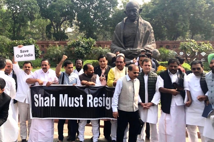 New Delhi: Congress legislators led by Rahul Gandhi, Adhir Ranjan Chowdhury and Shashi Tharoor stage a demonstration demanding Union Home Minister Amit Shah's resignation, in front of the Mahatma Gandhi statue at Parliament in New Delhi on March 2, 2020. (Photo: IANS) by . 