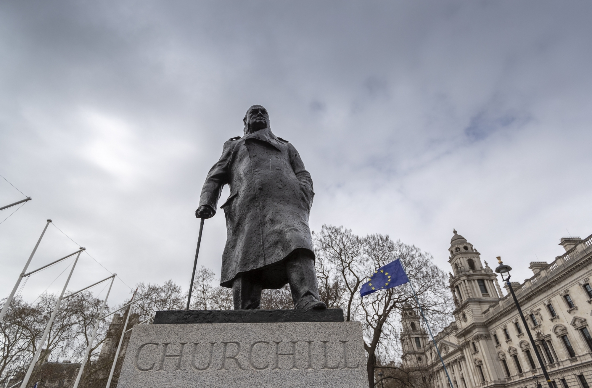 LONDON, March 23, 2019 (Xinhua) -- An EU flag and the statue of Winston Churchill are seen during the "Put it to the People" march in central London, Britain, on March 23, 2019. Hundreds of thousands of people on Saturday marched through central London calling for another referendum on Brexit as the country is caught by the Brexit impasse again. (Xinhua/Han Yan/IANS) by . 